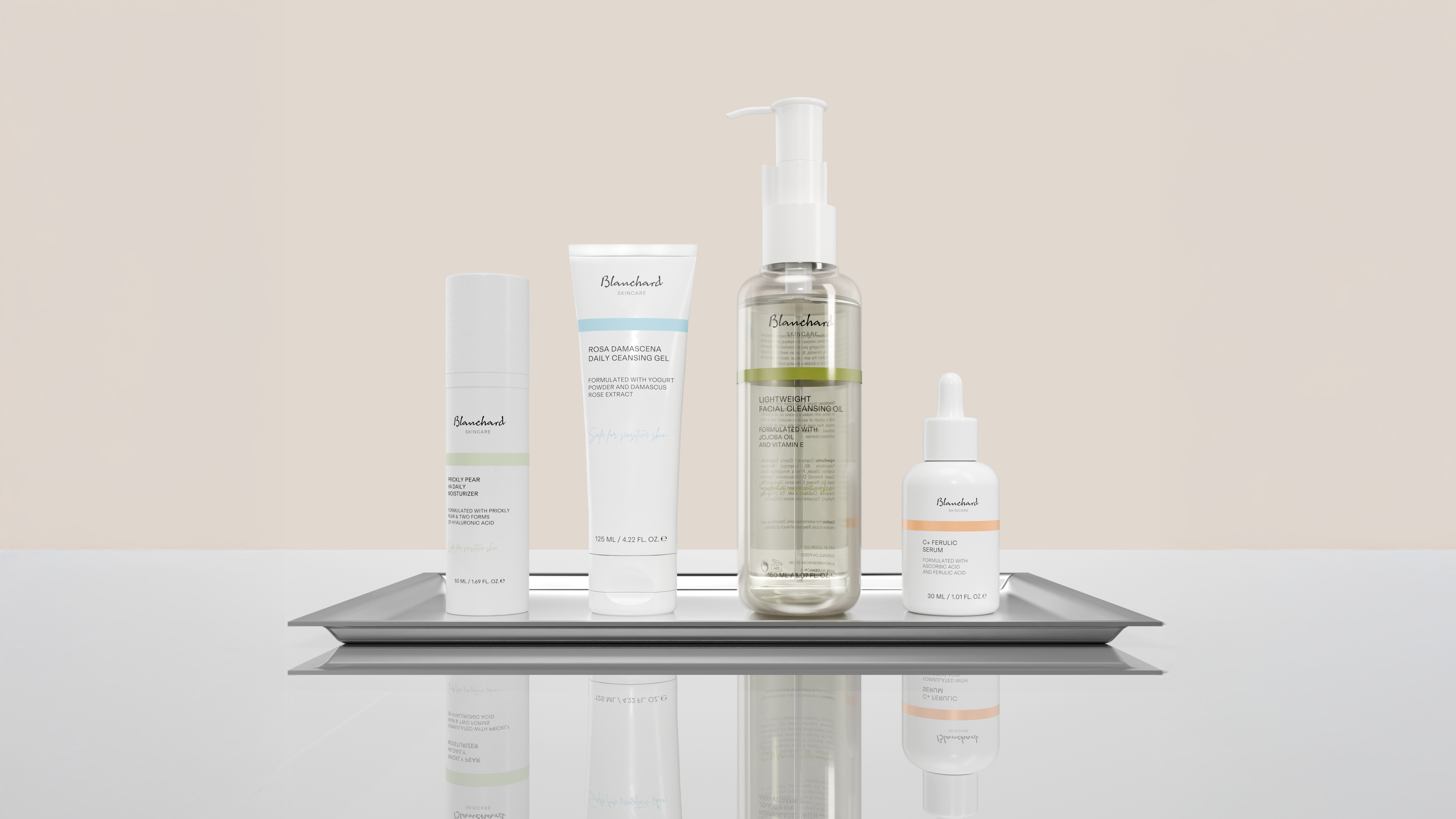 Blanchard Skincare full product lineup including Facial Cleansing Oil, Rosa Damascena Cleansing Gel, Prickly Pear HA Daily Moisturizer, and Vitamin C Serum on reflective surface