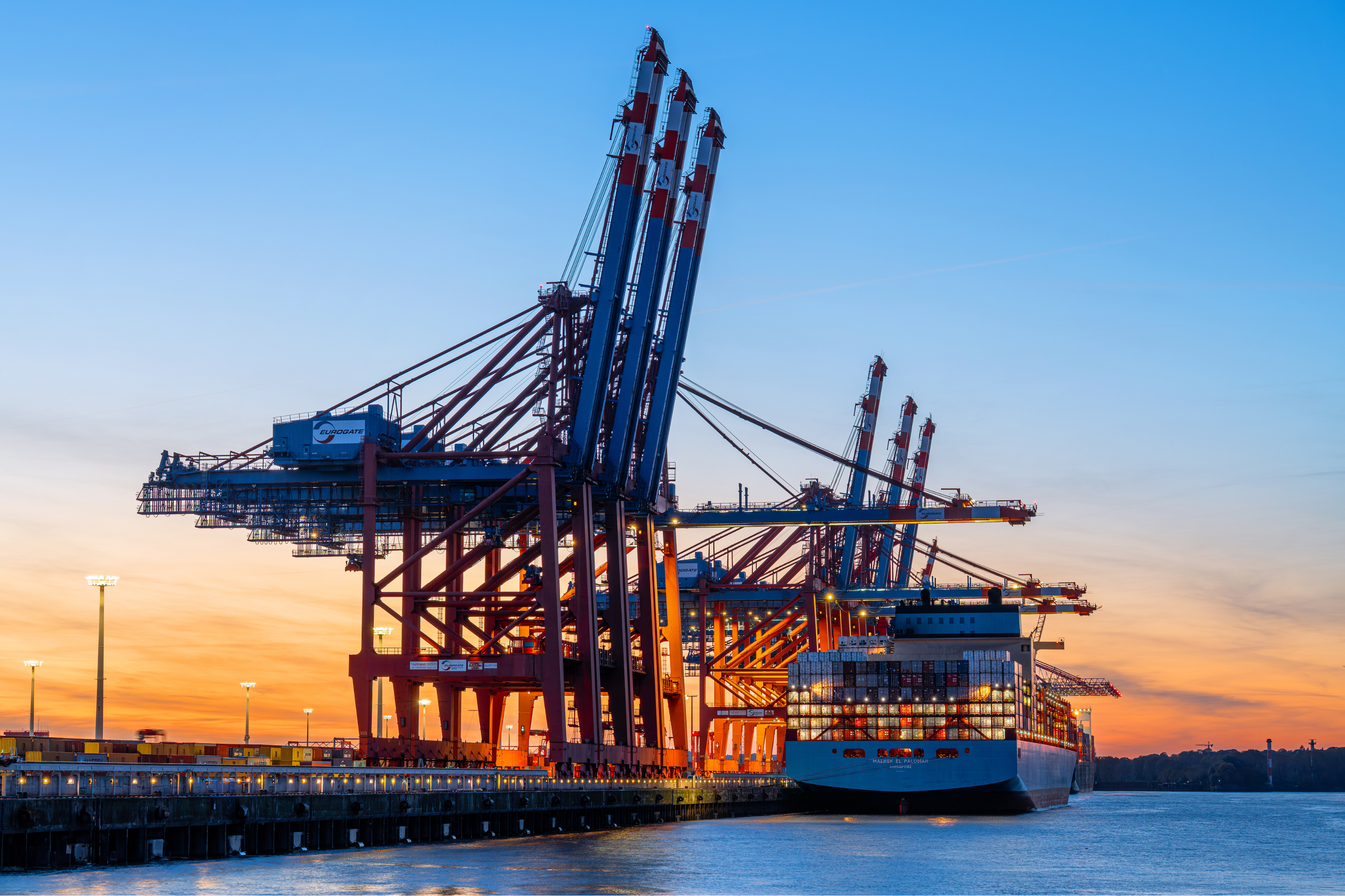 International shipping vessel at port representing Blanchard Skincare's global ingredient sourcing network