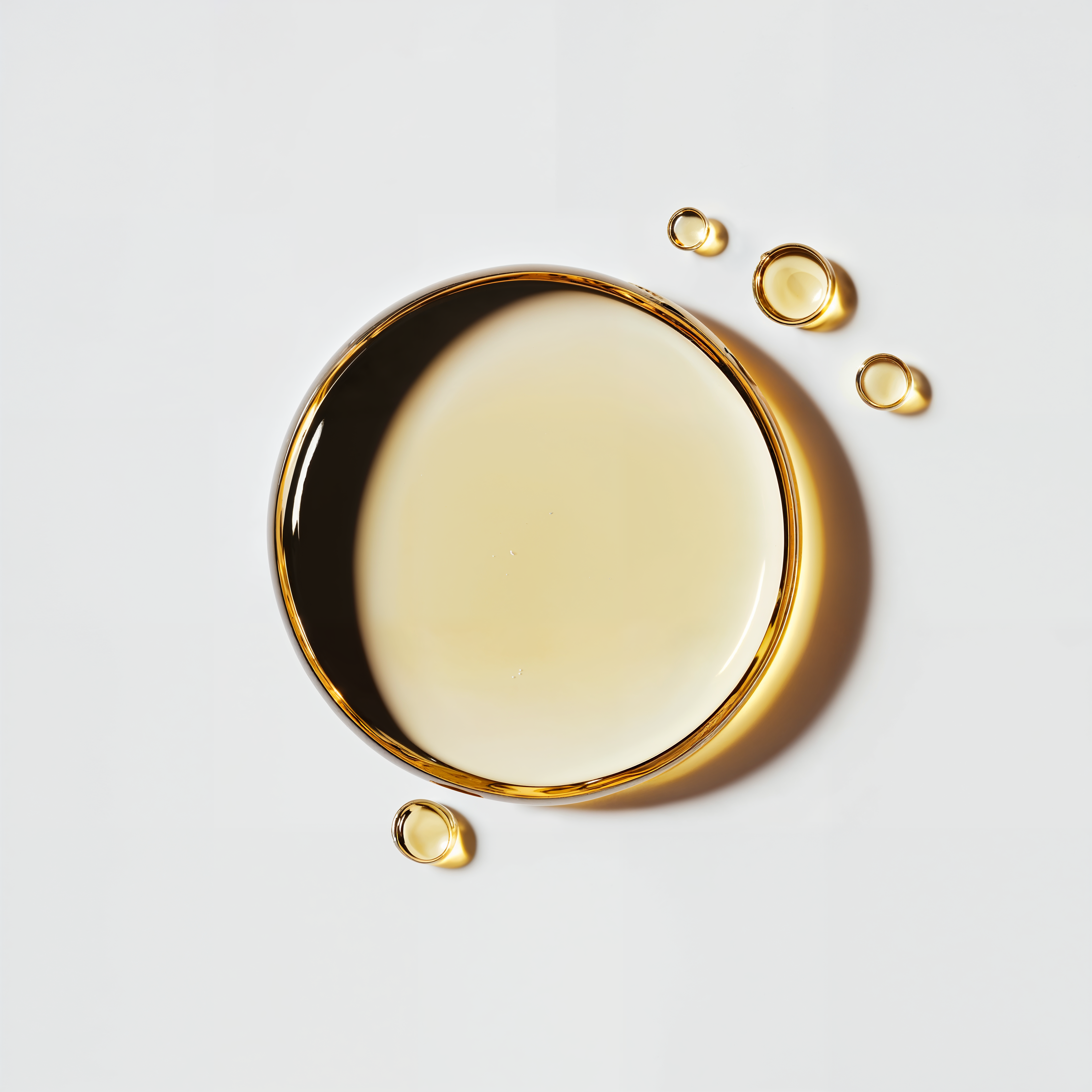 Golden serum droplets representing premium skincare formulation by Blanchard Skincare